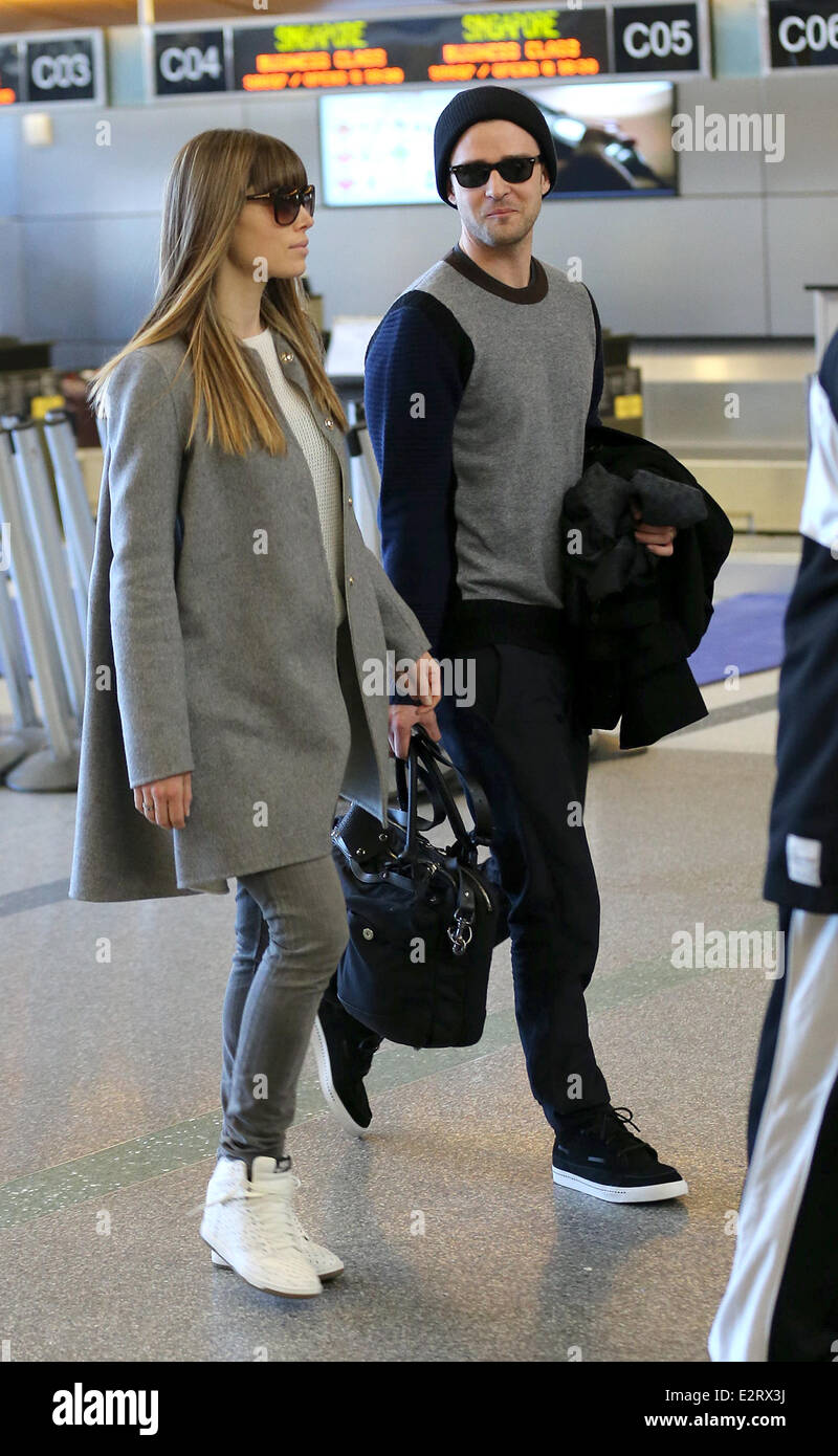 Justin Timberlake and wife Jessica Biel arrive at LAX airport together with a bodyguard  Featuring: Jessica Biel,Justin Timberlake Where: Los Angeles, California, United States When: 16 Feb 2013 Stock Photo