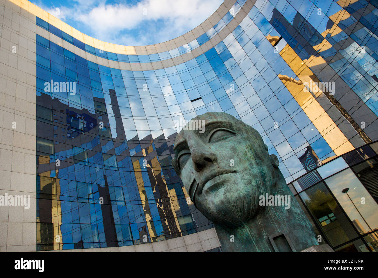 Sculpted figure at entrance to modern building in La Defense, Paris France Stock Photo