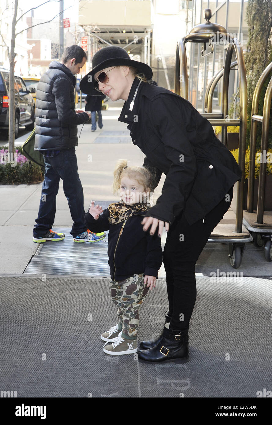 Swedish model Isabel Adrian is seen leaving her hotel with her daughter
