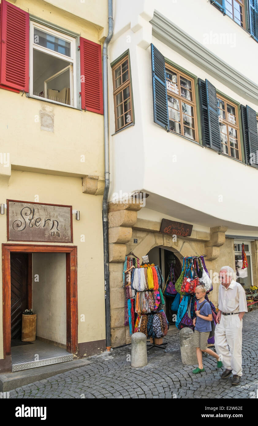 shop selling scarfs and bags and the entrance of restaurant stern in the old part of tuebingen, tuebingen, baden-wuerttemberg, g Stock Photo