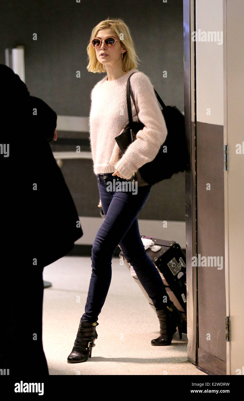 Rosamund Pike arrives at LAX airport wearing fashionable