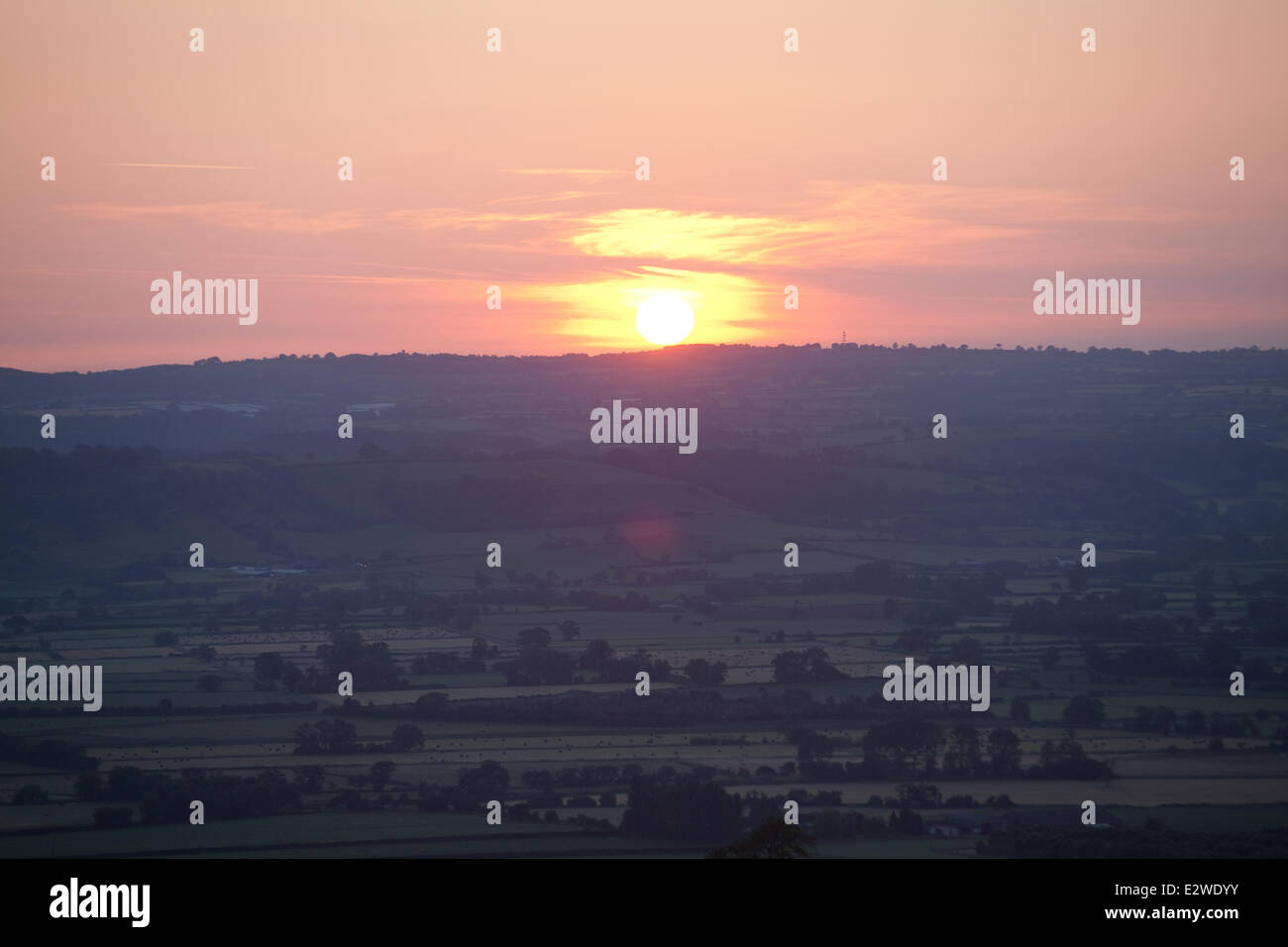 Glastonbury Tor, Somerset, UK. 21st June, 2014. Summer solstice sunrise at Glastonbury Tor, Somerset, UK. Credit:  Emma Stoner/Alamy Live News Stock Photo