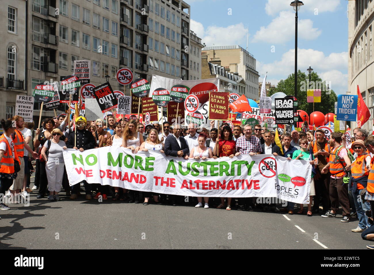 London, UK. 21st June, 2014. Thousands of people have joined a march, on Saturday, June 21, 2014, organised by The People's Assembly, Trade Unions and campaign groups under the slogan of 'No More Austerity: Demand the Alternative' have marched through central London from outside BBC headquarters to the Houses of Parliament where a rally was held. Demonstrators marched with banners and placards making their voices heard regarding many different issues including austerity, tax and the National Health Service (NHS). Credit:  Christopher Middleton/Alamy Live News Stock Photo