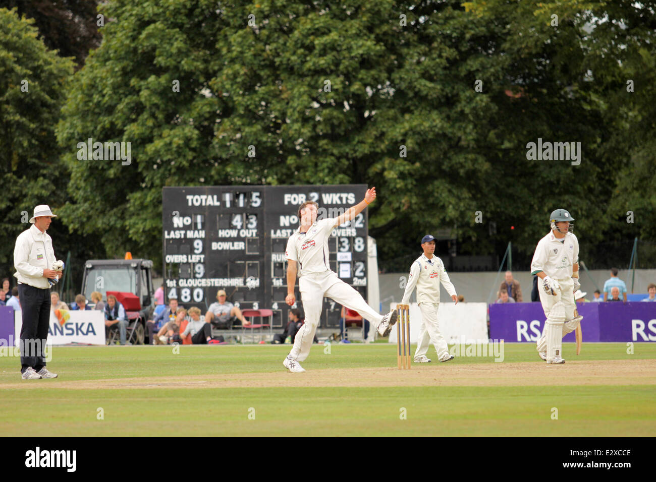 Men playing cricket at a match during the Cheltenham Cricket festival Stock Photo