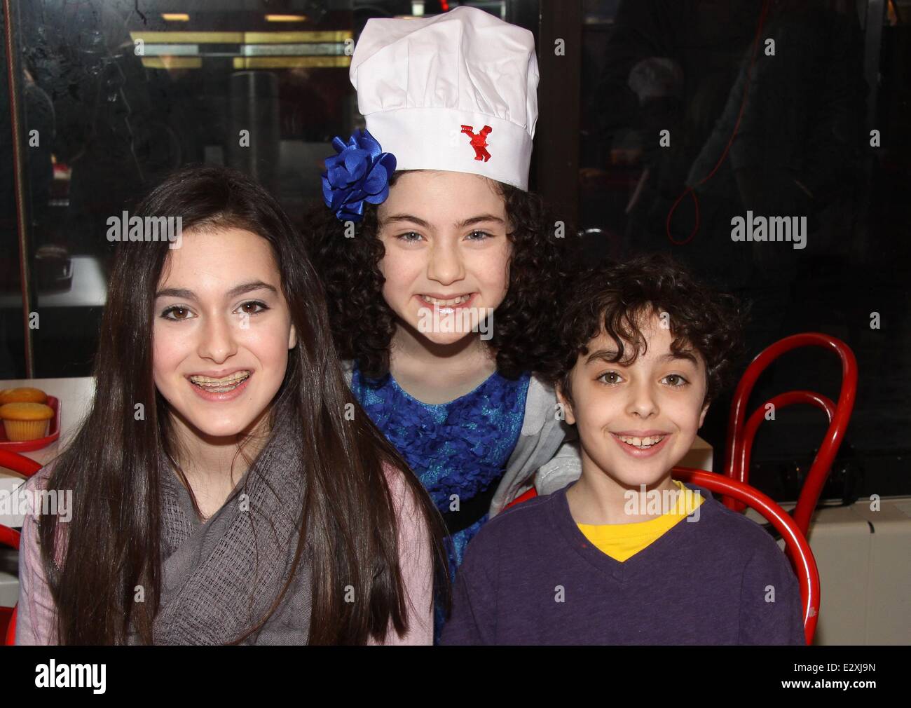 Annie star, Lilla Crawford's 12th Birthday Party held at the Cake Boss Café in Times Square  Featuring: Allie Drier,Lilla Crawford,Alex Drier Where: New York City, United States When: 25 Mar 2013 Stock Photo