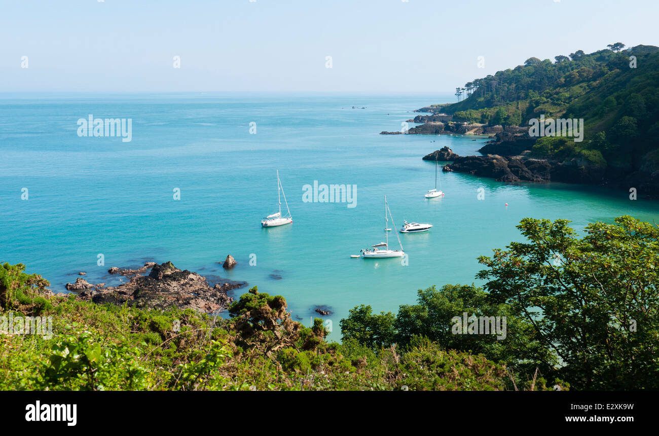 Boats moored in Fermain Bay, Guernsey Channel Islands, on a summer afternoon. Stock Photo