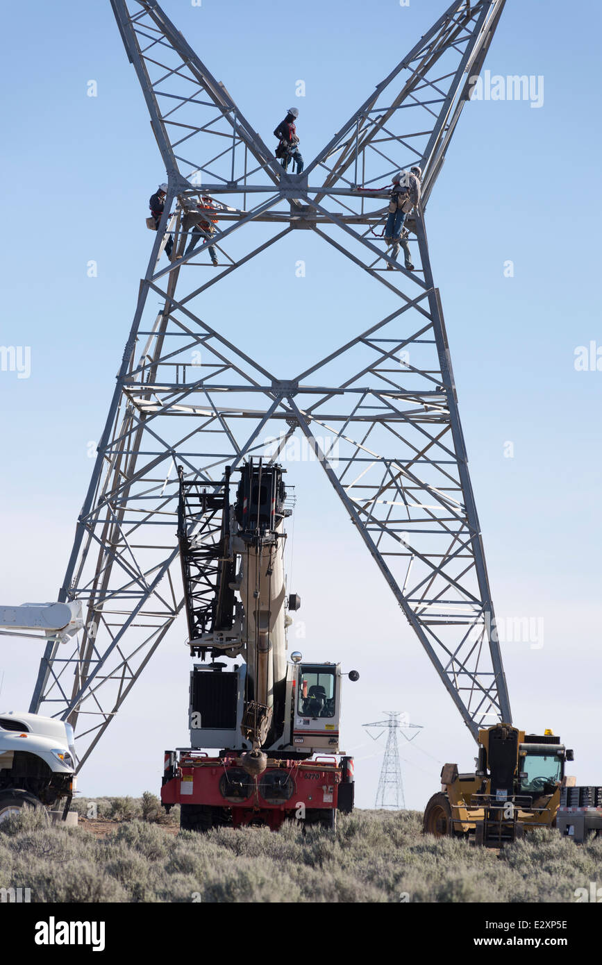 Construction crew assembling electricity transmission tower in Utah