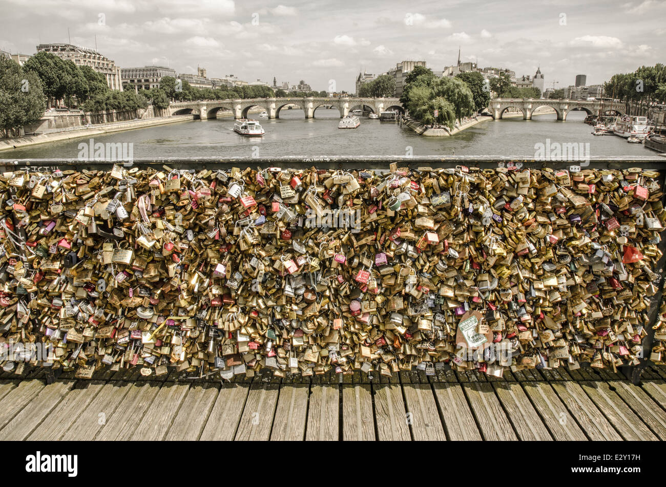 Love padlocks on the bridge Pont des Arts across river Seine in Paris