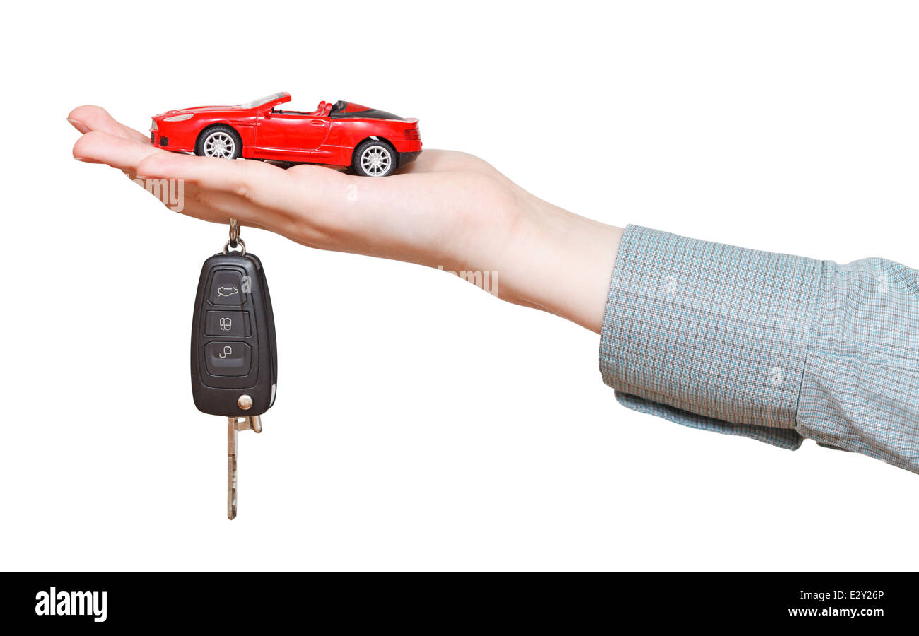 new red car with key on hand isolated on white background Stock Photo