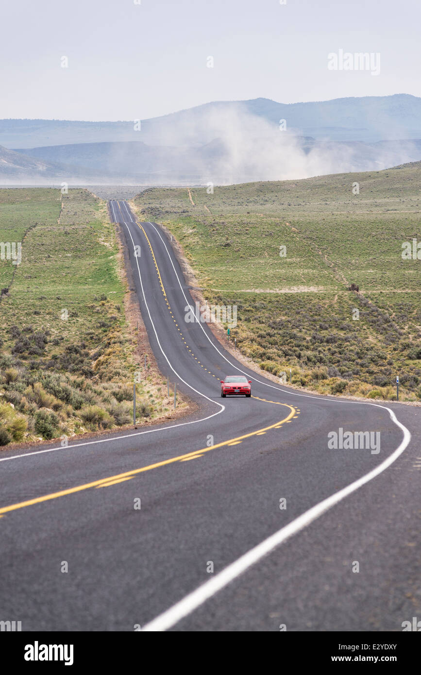 Car on a rural road in Eastern Oregon Stock Photo Alamy