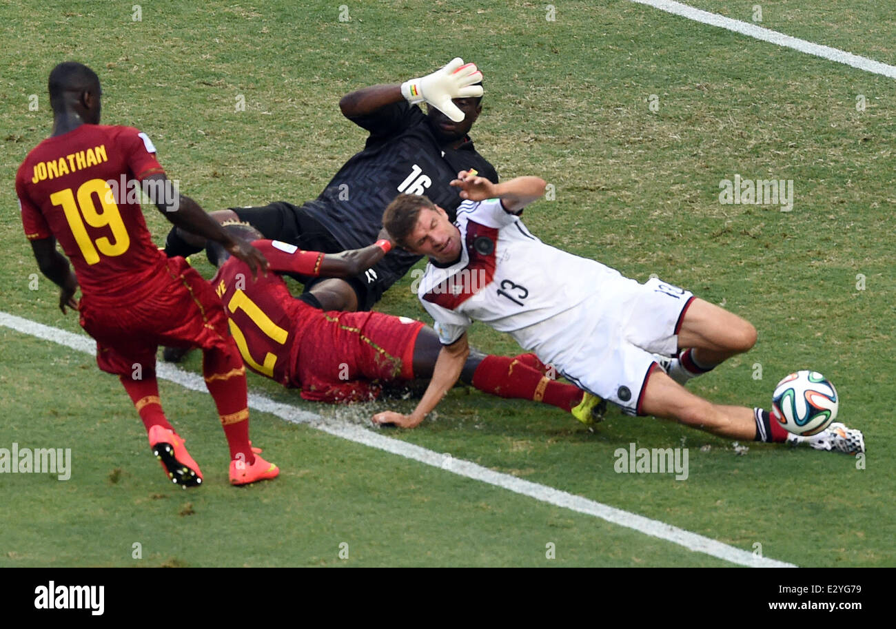 Fortaleza, Brazil. 21st June, 2014. Ghana's Jonathan Mensah (L-R), John Boye, goal keeper Fatawu Dauda and Germany's Thomas Mueller vie for the ball during the FIFA World Cup 2014 group G preliminary round match between Germany and Ghana at the Estadio Castelao Stadium in Fortaleza, Brazil, 21 June 2014. Photo: Marcus Brandt/dpa/Alamy Live News Stock Photo