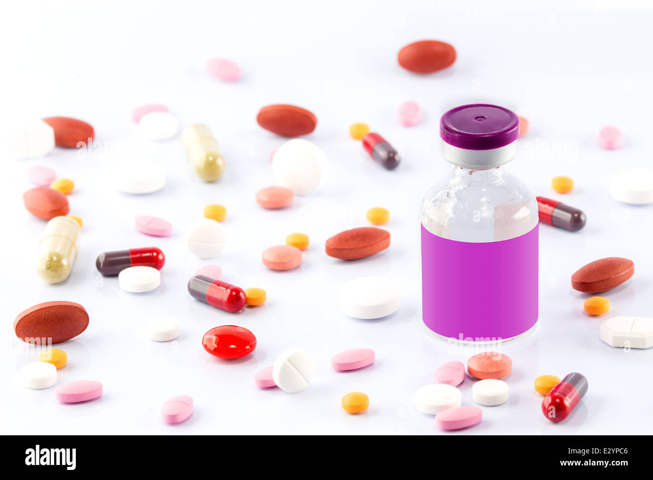 Injection vial and many kind of Medical pills isolated on white