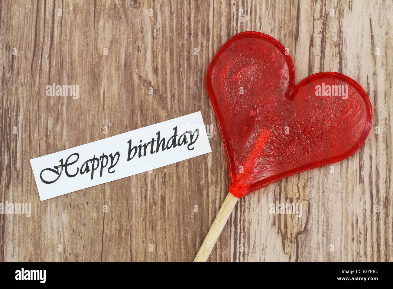 Happy Birthday card with heart shaped lollipop Stock Photo
