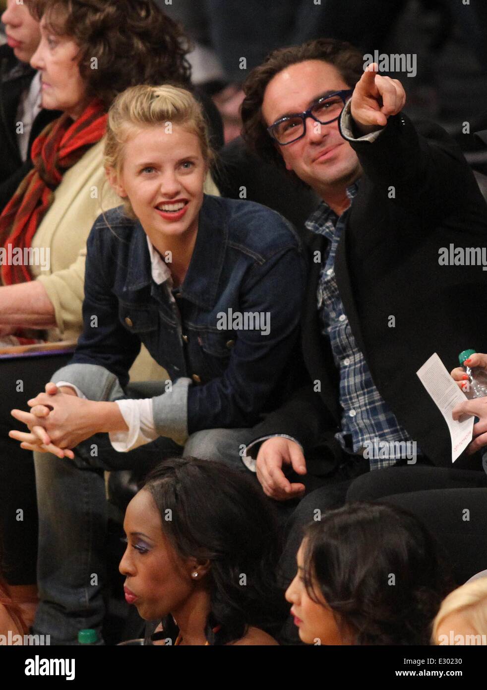 Celebrities watching Houston Rockets vs Los Angeles Lakers at the Staples Center in the final game of the regular season  Featuring: Johnny Galecki,Kelli Garner Where: Los Angeles, California, United States When: 17 Apr 2013 Stock Photo