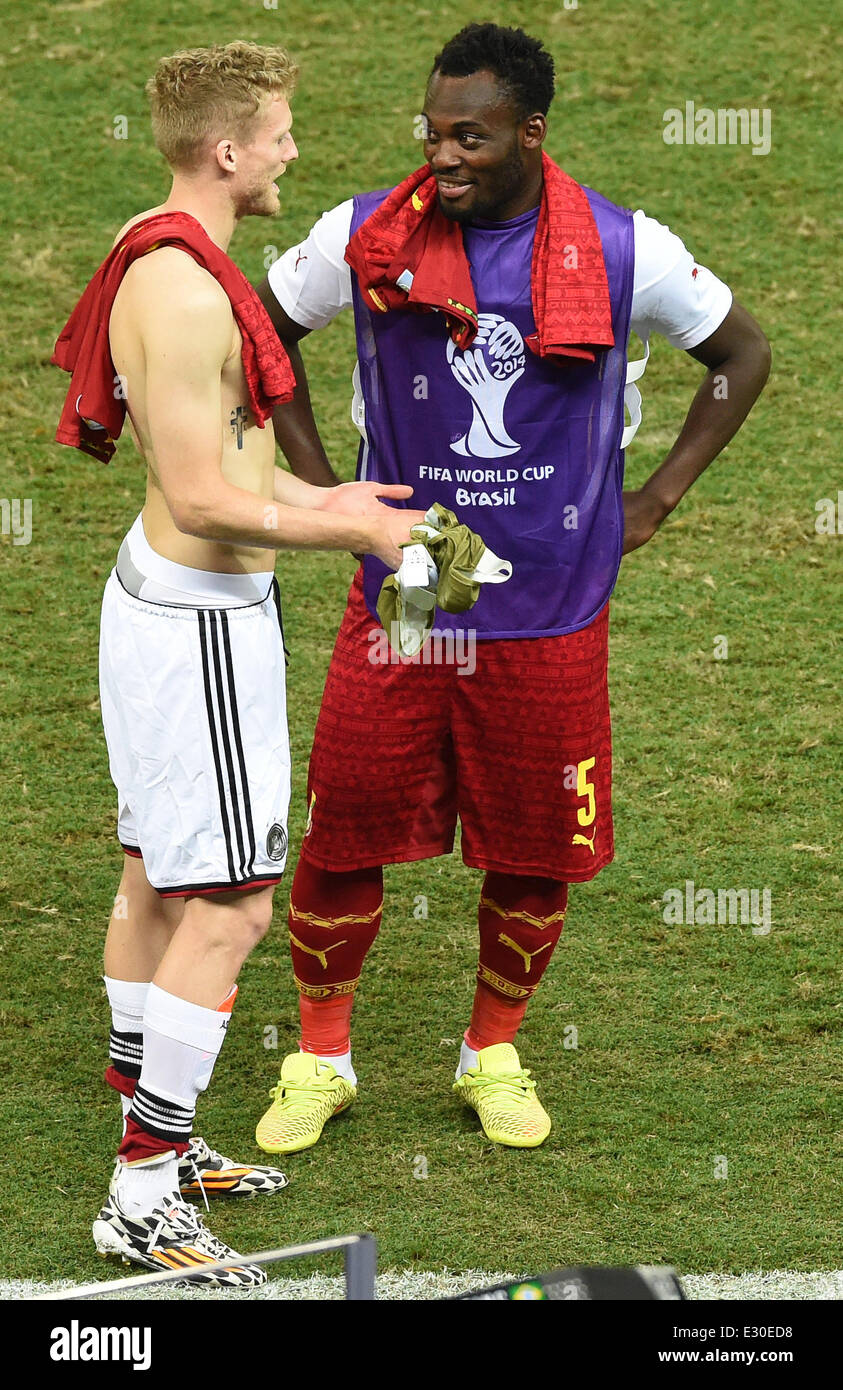 Fortaleza, Brazil. 21st June, 2014. Germany's Andre Schuerrle (L) talks to Ghana's Michael Essien after the FIFA World Cup 2014 group G preliminary round match between Germany and Ghana at the Estadio Castelao Stadium in Fortaleza, Brazil, 21 June 2014. Photo: Marcus Brandt/dpa/Alamy Live News Stock Photo