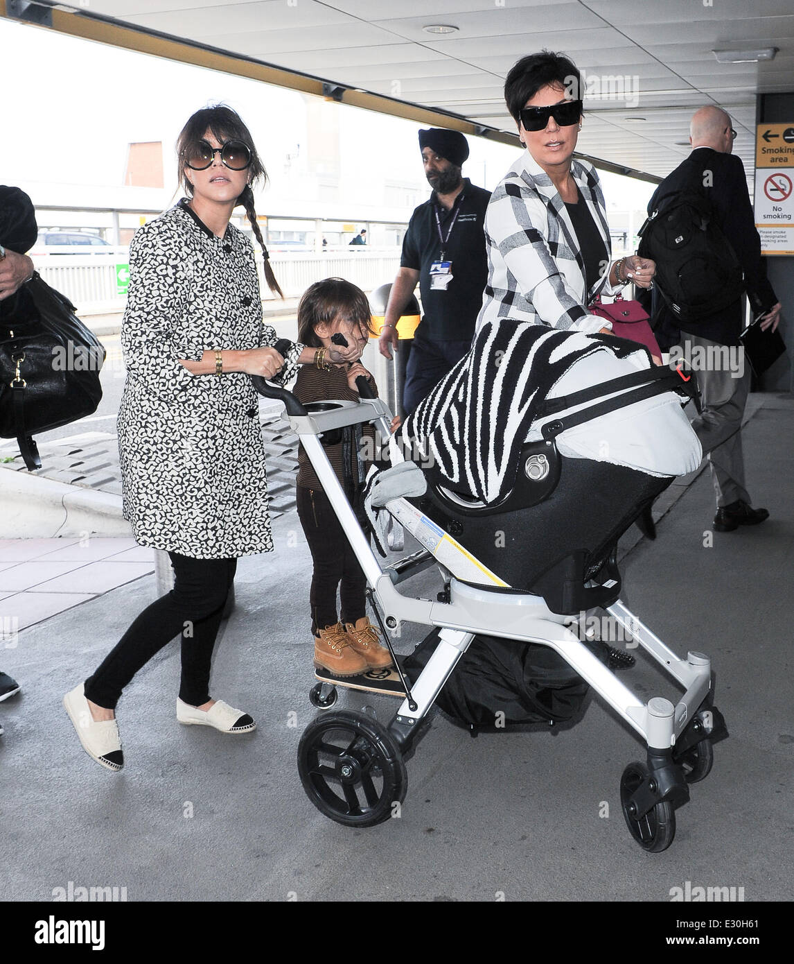 Kris Jenner and Kourtney Kardashian arriving at Heathrow Airport