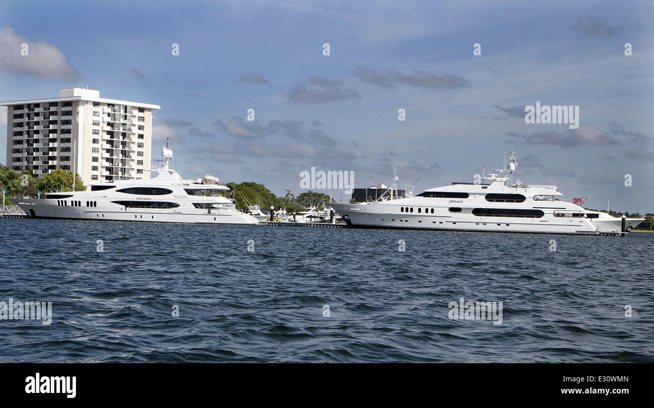 The super yacht 'Mine Games' owned by Chris Cline, top is parked in front of 'Privacy', owned by Tiger Woods, bottom,  Cline is said to be dating Elin Nordegren, Tigers Woods ex-wife. The yachts are seen here  docked in Jupiter Florida Monday April 29, 2013  Featuring: Atmosphere Where: Jupiter, Florida, United States When: 29 Apr 2013 Stock Photo