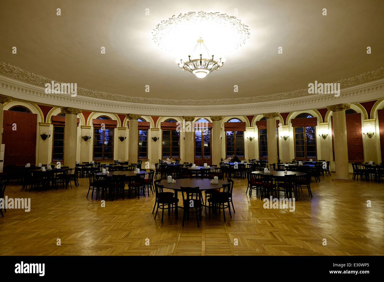 The elegant dining room of hotel Tskaltubo Spa Resort where Stalin used to spent his vacations in the town of Tskaltubo in Imereti province in the Republic of Georgia Stock Photo