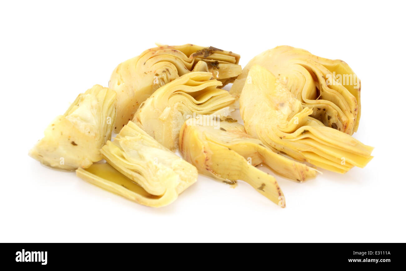 Artichoke heart segments in olive oil and herbs, isolated on a white