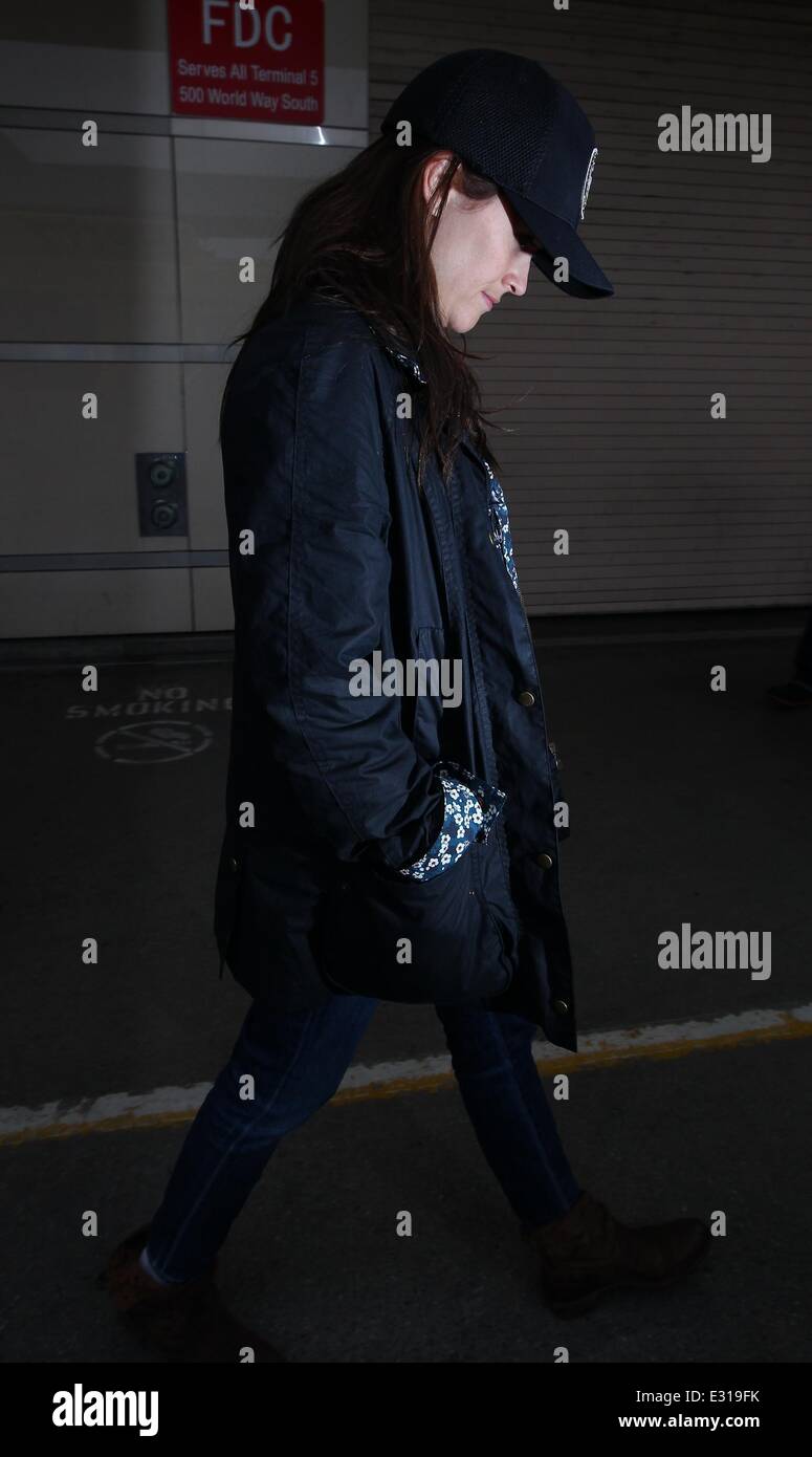 Reese Witherspoon, wearing a hat that reads 'City of Atlanta Police