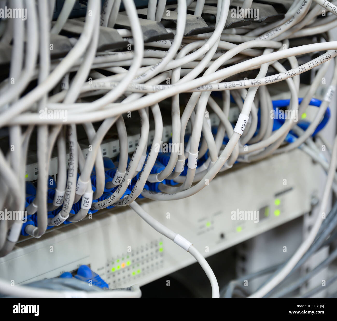close-up of mess pattern ethernet cables connected to computer internet server Stock Photo