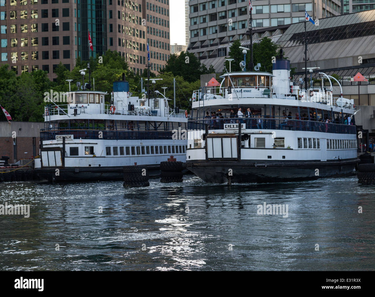 Two ferry boats wait to take passengers to the Toronto Islands a chain