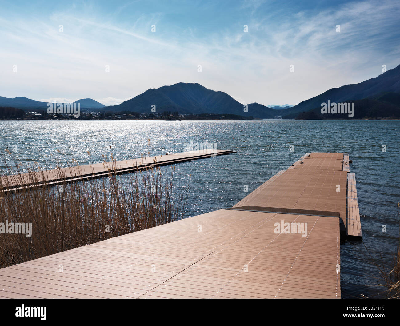 Docks at lake Kawaguchi surrounded by mountains. Fujikawaguchiko, Yamanashi, Japan near Mount Fuji. 2014. Stock Photo