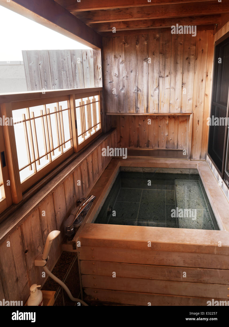Onsen, private hot spring bath tab at a ryokan traditional Japanese hotel. Fujikawaguchiko, Yamanashi, Japan. Stock Photo