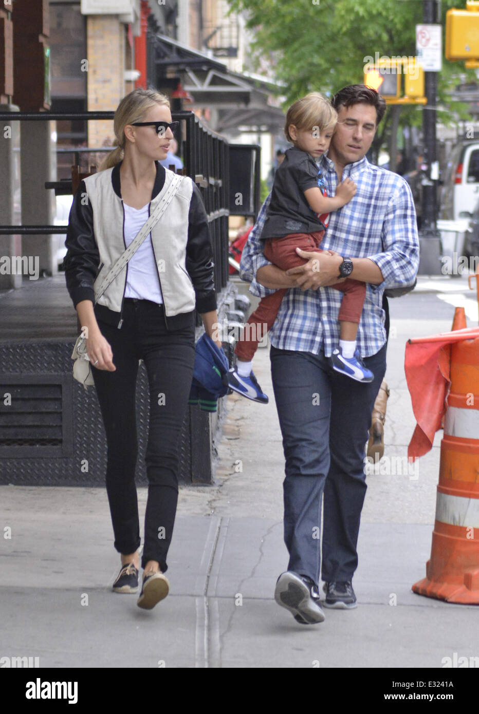 Karolina Kurkova and Archie Drury walk with their son Tobin Jack in