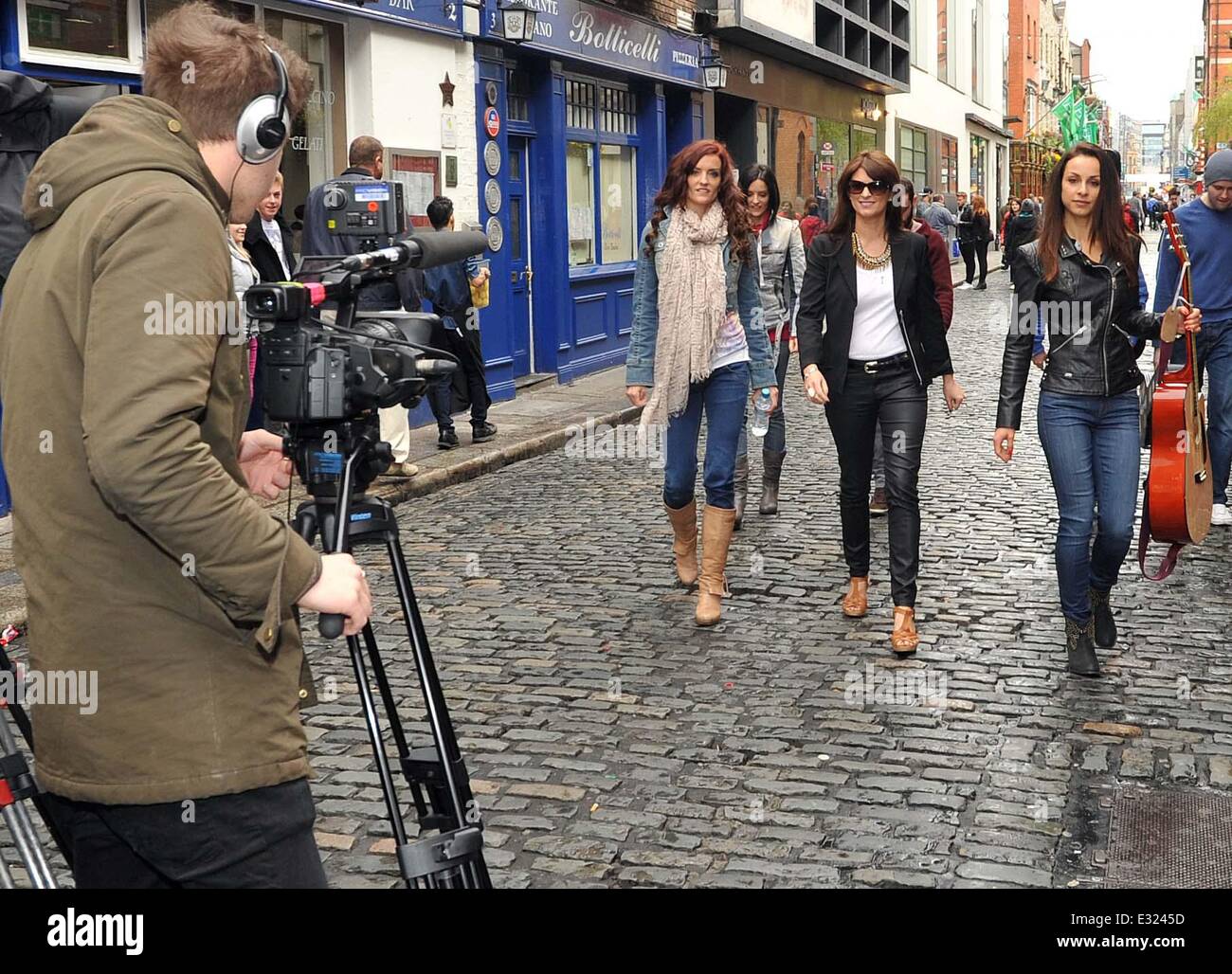 Irish girl band B*Witched busking for charity in Temple Bar Square while filming a segment for ITV's 'The Big Reunion'. B*Witched singer Sinead O'Carroll's mum even performed a little dance when the girls were singing their hit song 'C'est la Vie'.  Featu Stock Photo