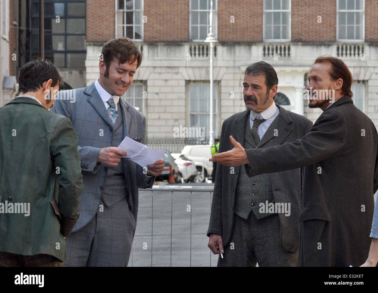 Matthew McFadyen, Jermome Flynn and Adam Rothenberg filming scenes for BBC's Ripper Street on North Great Georges Street. In the scene a police detective is thrown out of a window and impaled on the railings outside. Senator David Norris who lives on the Stock Photo
