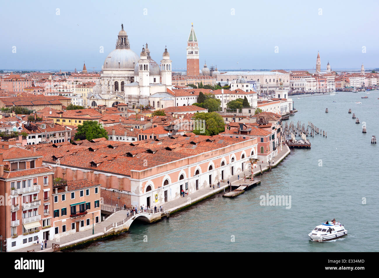 View from cruise ship departing Venice on the Giudecca Canal approaching Santa Maria della Salute church & Grand Canal junction Stock Photo