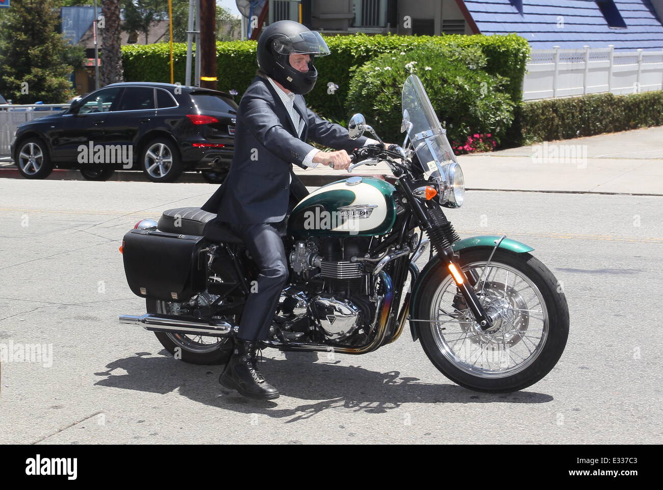 William H Macy arrives at the Palihouse Hotel on his Triumph motorbike