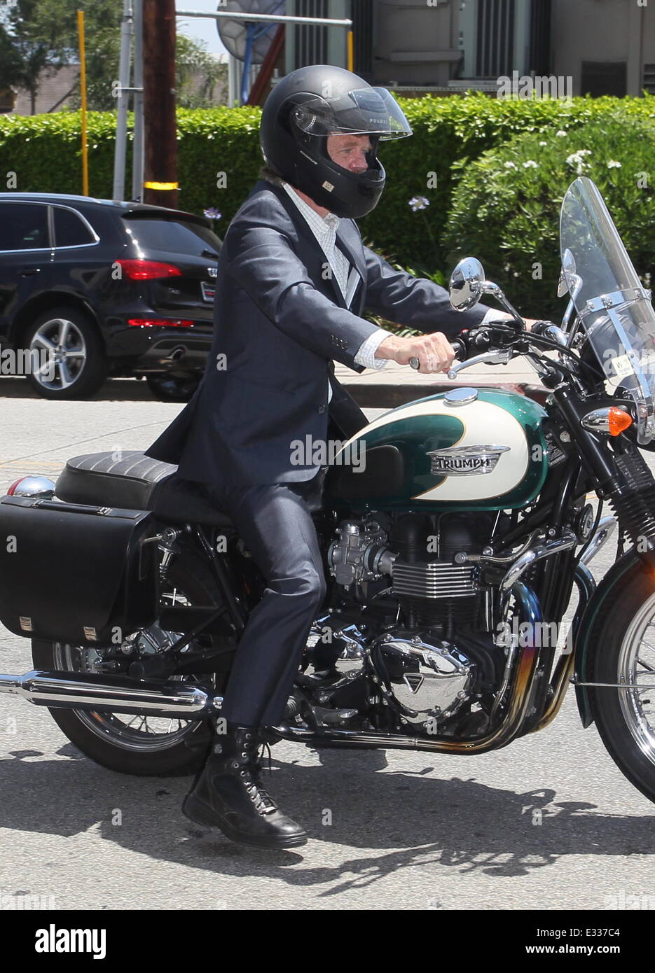 William H Macy arrives at the Palihouse Hotel on his Triumph motorbike