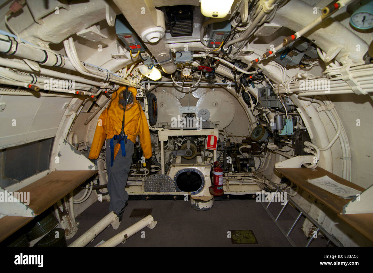 HMAS Ovens aft compartment. The picture shows the rear torpedo tube, escape outfit and desks used for on-board teaching. Stock Photo