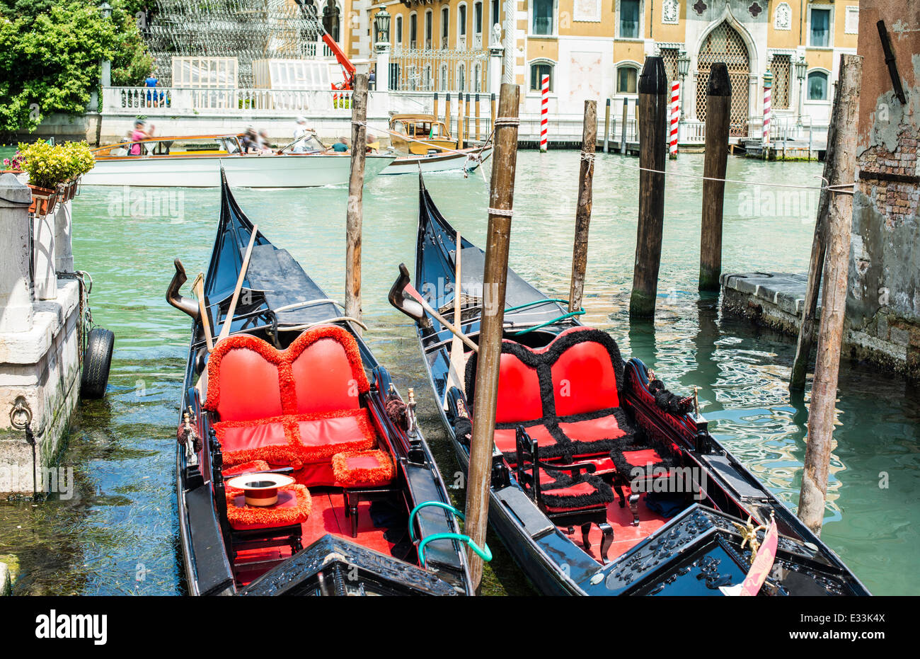 Ancient gondolas boat in Venice. Gondola red color interior Stock Photo