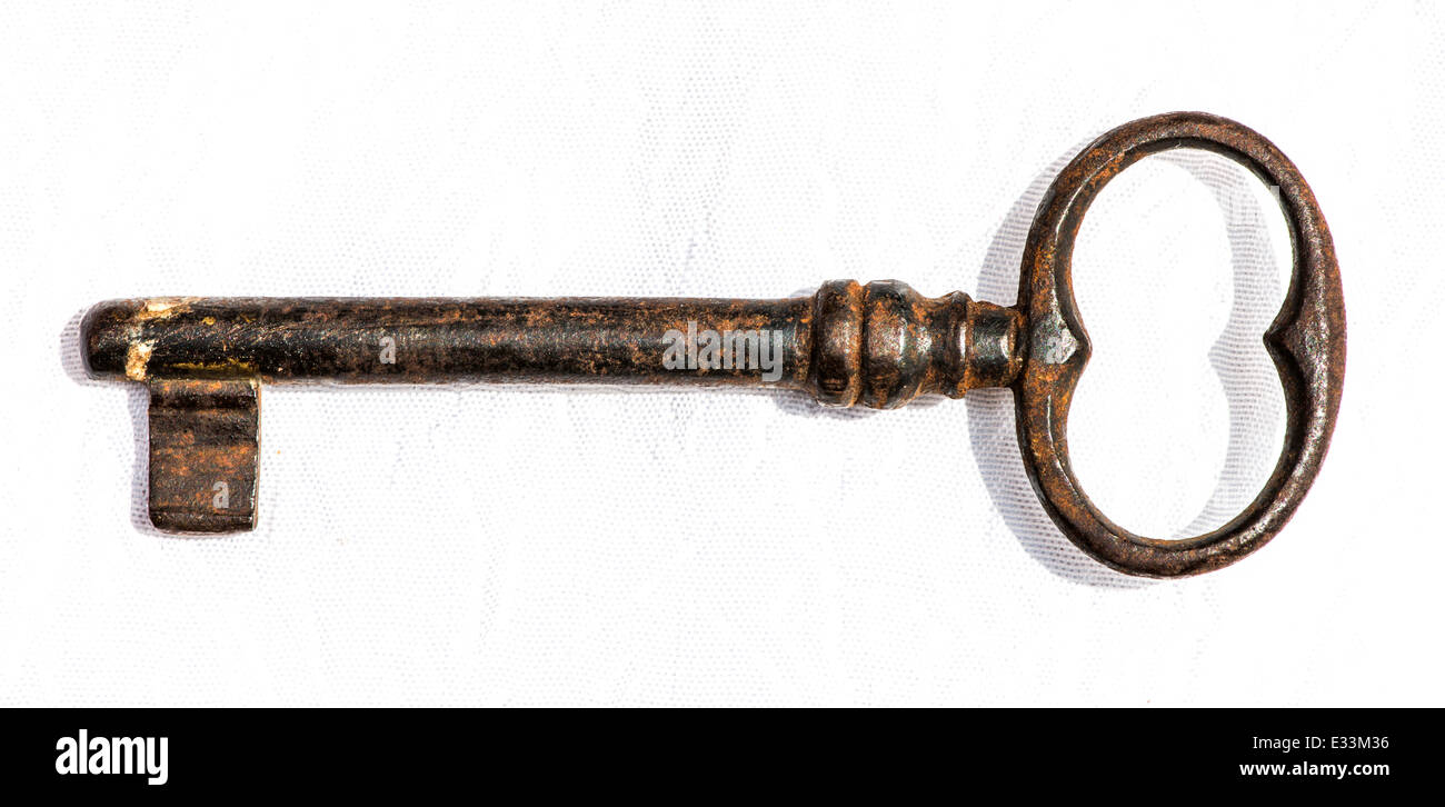 Old antique key on white Stock Photo