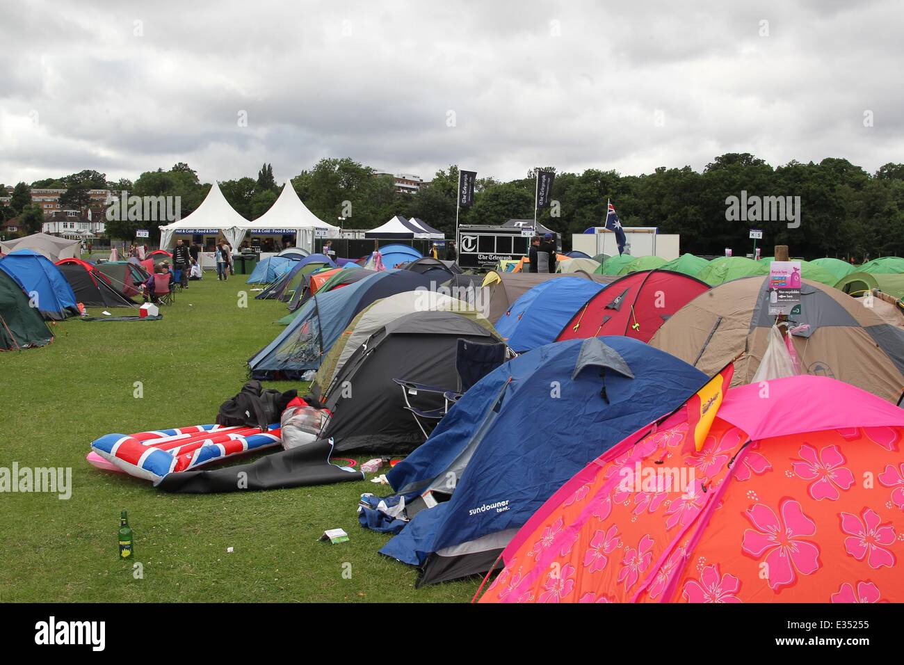 Tennis fans camp out at Wimbledon ahead of the opening day of the 2013 All England Lawn Tennis Championships. Some campers pass Stock Photo