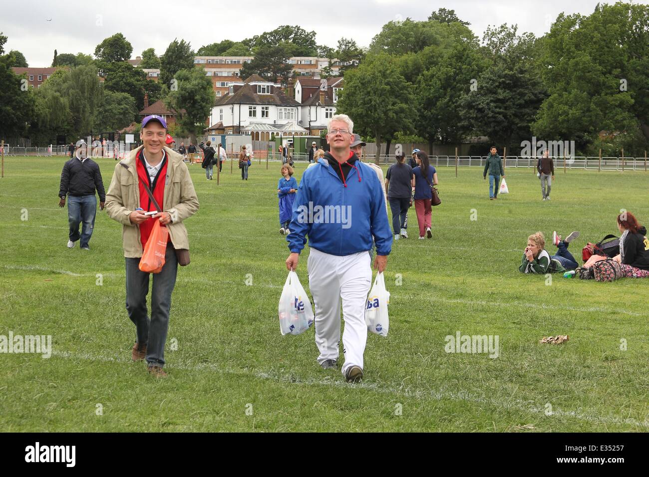 Tennis fans camp out at Wimbledon ahead of the opening day of the 2013 All England Lawn Tennis Championships. Some campers pass the time by playing their own form of tennis on the playing fields opposite.  Where: London, United Kingdom When: 23 Jun 2013 Stock Photo