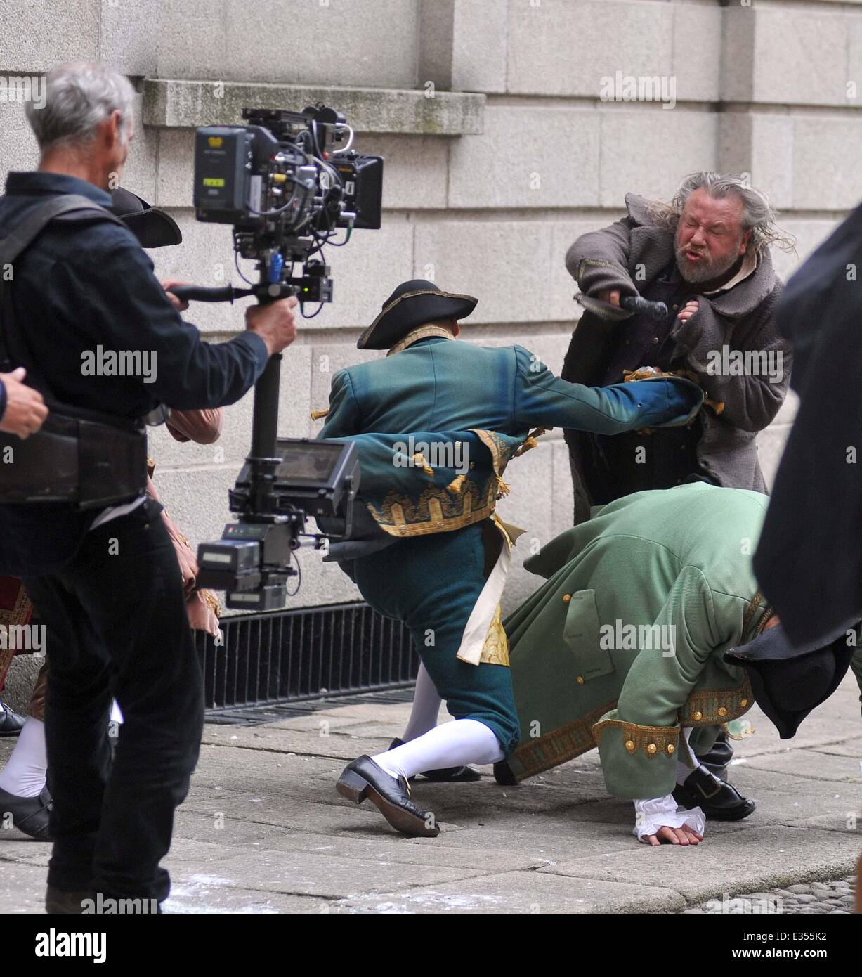 Actors Ray Winstone,Aneurin Barnard and Actor/Comedian Omid Djalili filming Sky TV's new Drama MoonFleet today at Kings Inn.Todays scene was a fight scene where Winstone and Barnard jump out of a window and are then involved in a fight.Winstone and Barnard also had a joke fight between takes while Omid Djalili played football with a stone rock from props.  Featuring: Ray Winstone Where: Dublin, Ireland When: 25 Jun 2013   **Not available for publication in Irish Tabloids or Irish magazines** Stock Photo