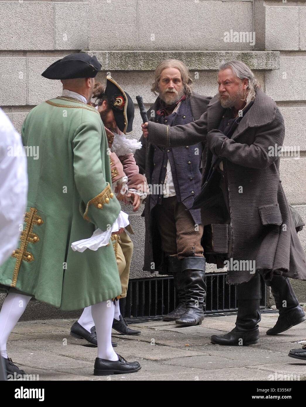 Actors Ray Winstone,Aneurin Barnard and Actor/Comedian Omid Djalili filming Sky TV's new Drama MoonFleet today at Kings Inn.Todays scene was a fight scene where Winstone and Barnard jump out of a window and are then involved in a fight.Winstone and Barnard also had a joke fight between takes while Omid Djalili played football with a stone rock from props.  Featuring: Stunt Doubles Where: Dublin, Ireland When: 25 Jun 2013  **Not available for publication in Irish Tabloids or Irish magazines** Stock Photo