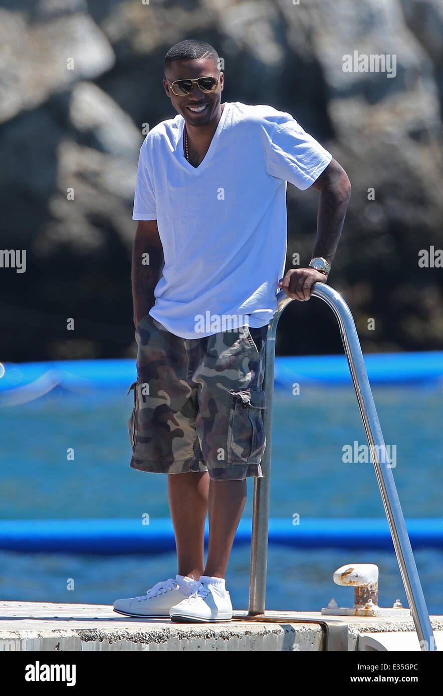 Rapper Nas enjoys a day with friends at the Hotel Du Cap-Eden Roc  restaurant in the south of France Featuring: Nas,Nasir bin Olu Dara Jones  Where: Cap D' Antibes, France When: 30