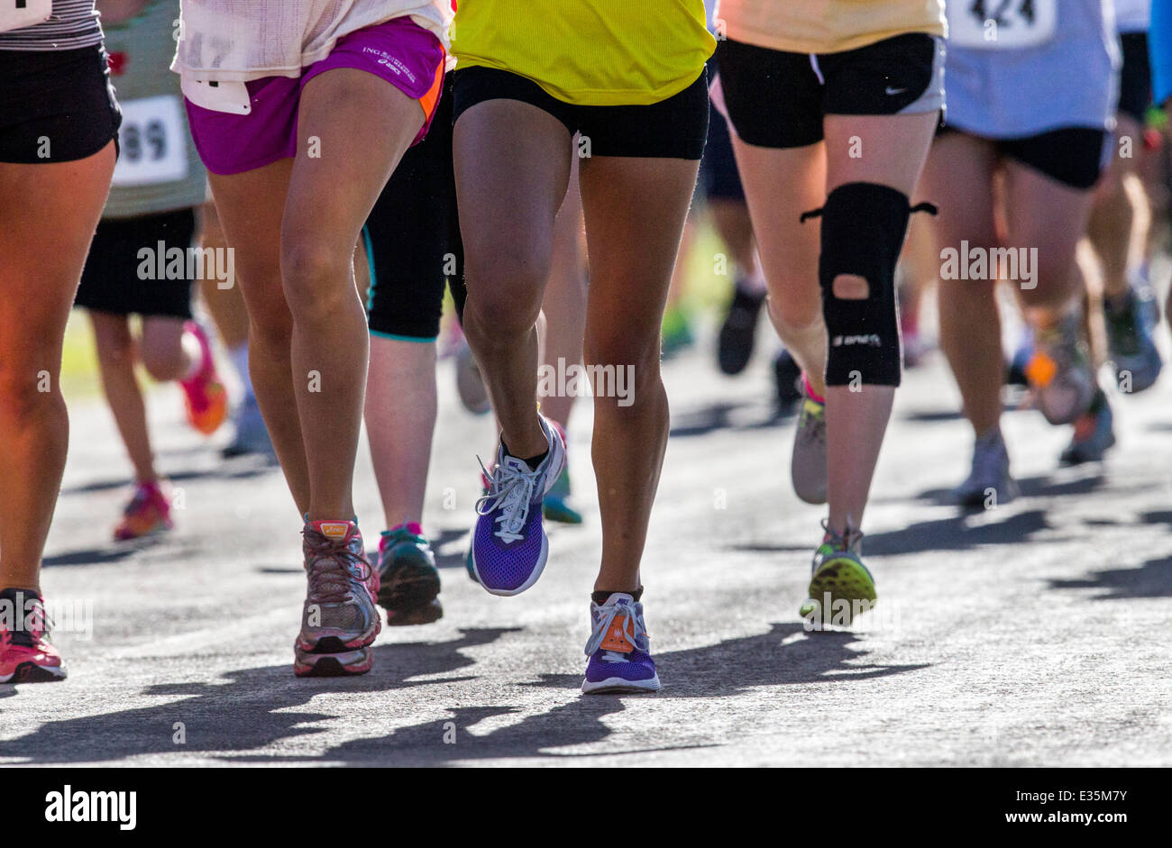Close-up of runners legs and feet in 5K & 10K foot races, annual FIBark festival, Salida, Colorado, USA Stock Photo