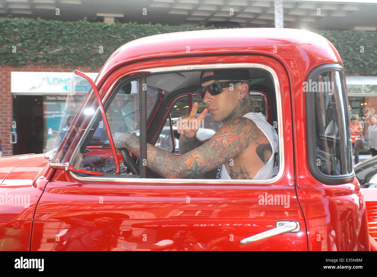 Travis Barker and his daughter Alabama Luella Barker stop for a cold