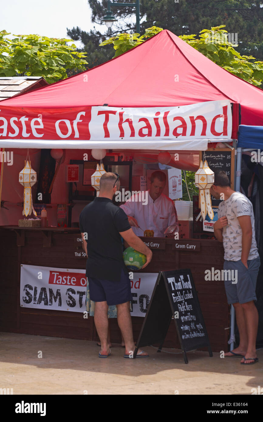 Bournemouth Food and Drink Festival - customers at the Taste of Thailand stall at The Square, Bournemouth Town Centre, Dorset UK Stock Photo