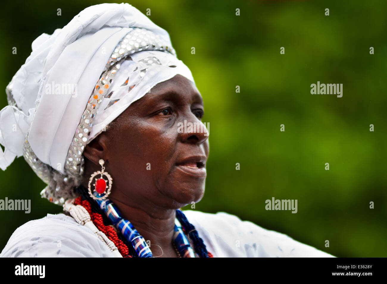 A priestess of Candomblé (Mãedesanto, iyalorishá) seen during the ritual in honor to Saint A priestess of Candomblé (Mãedesanto, iyalorishá) seen during the ritual in honor to Saint