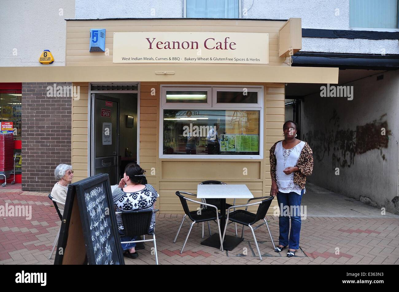 Cafe owner Martha-Renee Kolleh got fed up of racist remarks and  took matters into her own hands and has placed the sign on the door of the Yeanon Cafe, in Ossett, West Yorkshire, which reads: 'I am a black woman...If you are allergic to black people, don Stock Photo