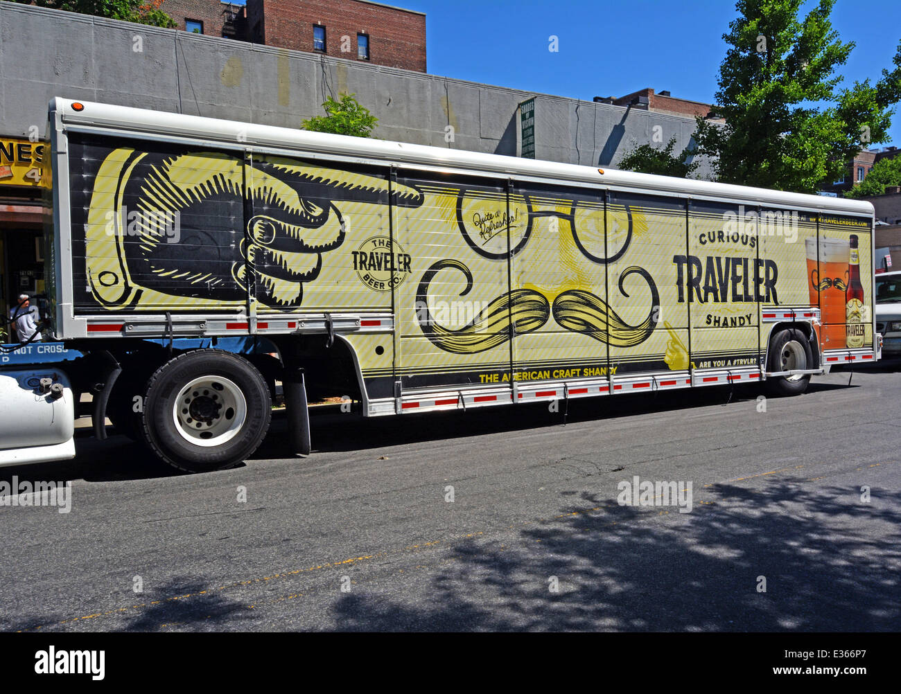 A truck delivering fruit beer in Jackson Heights, Queens, New York with old fashioned art deco design advertisement Stock Photo