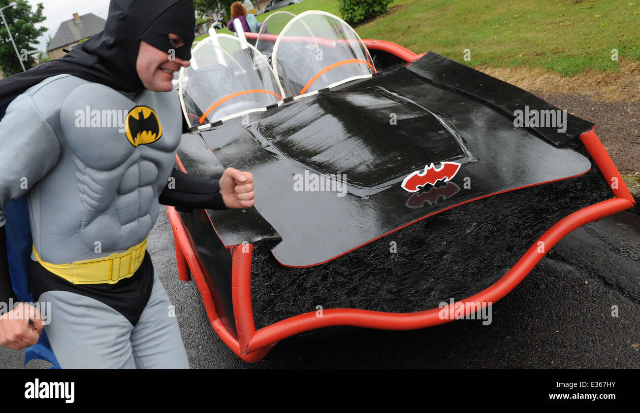 Batman and Robin fans Findlay Erskine, 40, and son Lewis, 12, made the car -- complete with batwing tail-fins -- out of an old Skoda at their home in Linlithgow, West Lothian. Findlay, who works as a builder, revealed the project was a woodwork exercise for Lewis, who is home-schooled. He said: It was Lewis' idea for a woodwork exercise, and I was easy to persuade because we're both Batman fans and I've always wanted to cut the roof off a car. It was a Skoda, but we cut the roof off in the garage, stripped the mirrors then made a frame around it with MDF board. We did the windows with pie Stock Photo