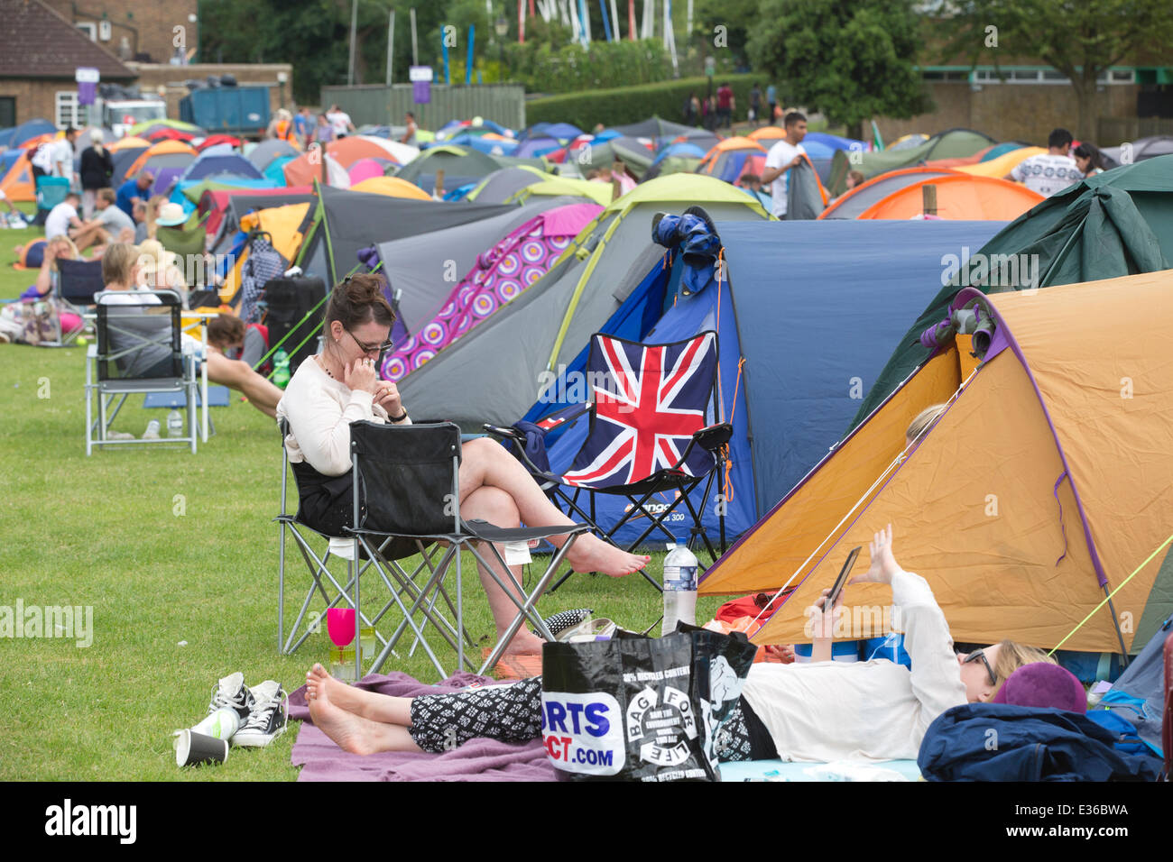 Wimbledon Park, London, UK. 22nd June, 2014. Tennis enthusiasts camp in Wimbledon Park overnight hoping to get a ticket for the opening match in Centre Court to see Andy Murray defend his title. Credit:  Clickpics/Alamy Live News Stock Photo